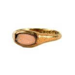 A 9ct gold dress ring, set with pale pink stone (AF), with pitted shoulders and rectangular ring