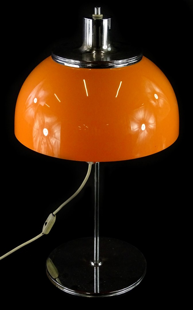 A Harvey Guzzini Faro table lamp, of mushroom form, with an orange plastic shade and chrome plated