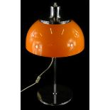 A Harvey Guzzini Faro table lamp, of mushroom form, with an orange plastic shade and chrome plated