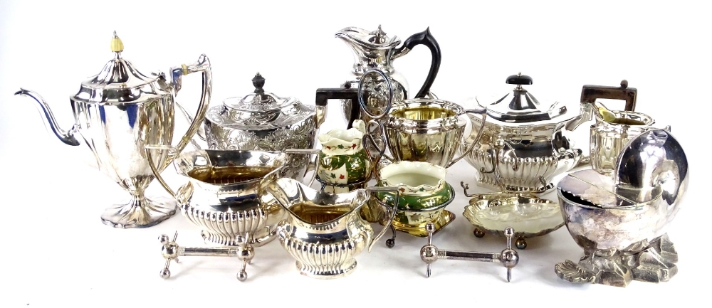 A collection of silver plate, to include part tea and coffee service, shell shaped spoon warmer,
