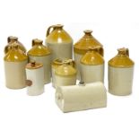 A quantity of stoneware bottles, various sizes, two stoneware bed warmers, no makers stamps.