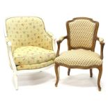 A French walnut open armchair, with a padded back, armrest and seat, upholstered in gold pattern