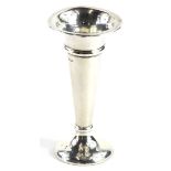 A George V silver specimen vase, of tapering form, on a domed foot, loaded London 1919, 16cm high.