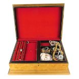 A tan faux leather jewellery box and contents, comprising four silver dress rings, gold plated