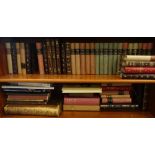 Various decorative leather and canvas bound bindings and other books.