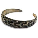 A David Anderson silver torc bangle, with graduated engraved scroll design, marked Norway,