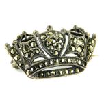 A marquasite set crown brooch, 3cm wide, marked Silver England, 4.8g all in.