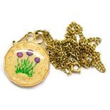 A modern coin pendant and chain, with a three pence piece enamel decorated pendant, in gold plated