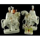A pair of 19thC Staffordshire flat backed figures, each model in the form of a Scotsman on