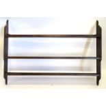 A 19thC painted pine plate rack, with three galleried sections, 144cm wide.
