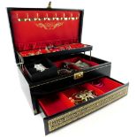 A black faux leather jewellery box and contents, comprising dress earrings, dress rings, hoop