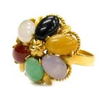 A multi stone set dress ring, set with six oval cut semi precious stones, in a yellow coloured