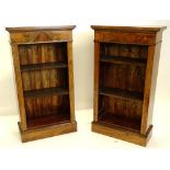 A pair of walnut open bookcases, in Victorian style, with two adjustable shelves, on a plinth