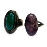 Two stone set dress rings, comprising a green polished stone set dress ring, marked Sterling,