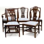 A harlequin set of five mahogany and elm dining chairs, four with a pierced splat and a blue chequed