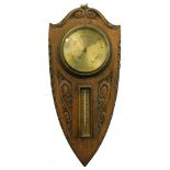 A late 19thC weather station, comprising aneroid barometer and thermometer, on shield shaped