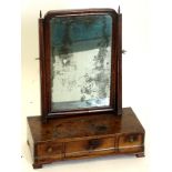 A 19thC walnut dressing table mirror, the rectangular mirror plate on tapering supports, the chequer