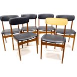 A set of six 1960s teak dining chairs, each with black PVC padded backs and seats. The upholstery in