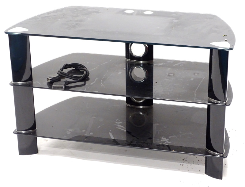 A three tier glass and metal television stand.