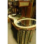 A kidney shaped dressing table with material surround, newspaper rack, dropleaf side table, three