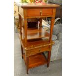 A pair of yew veneered two tier bedside tables, each with a drawer.