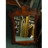 A fret framed wall mirror. Provenance: The Estate of Miss Rachel Monson.