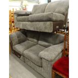 A four seat corner sofa, upholstered in grey cord.