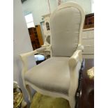 A cream painted French style armchair, upholstered in grey fabric. The upholstery in this lot does