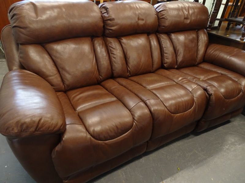 A leather reclining three seat sofa.