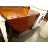 A mahogany oval drop leaf table, on square tapering legs.