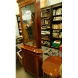 A yew wood finish freestanding corner cabinet, with dentil top, textured glass and cupboard