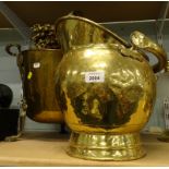 A hammered brass coal bucket, and another.