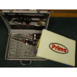 A Prima knife set, in metal carry case.