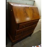 A mahogany veneered bureau, with three drawers on cabriole legs.