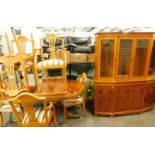 A yew wood finish dining room suite, comprising display cabinet, D end table with leaf and six (