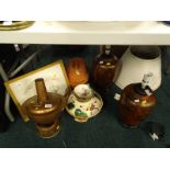A pair of table lamps, tagine, terracotta lidded dish etc. (contents of under one table).