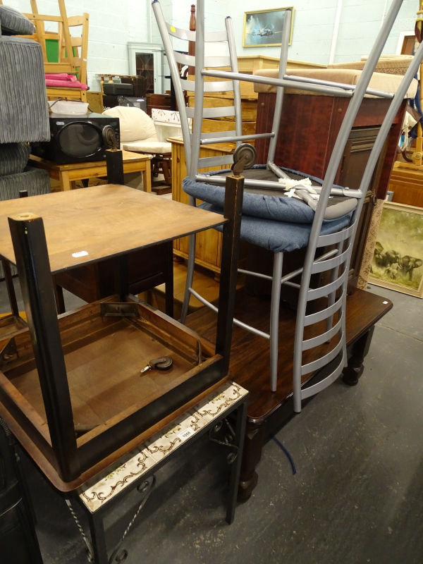 A quantity of furniture, to include a metal and tile top table, trolley, two metal kitchen tables,
