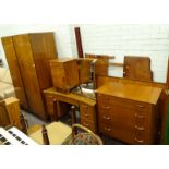 A Wrighton walnut bedroom suite, comprising wardrobe, concave dressing table, bedside cabinet,