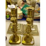 A pair of brass candlesticks, and a further plated pair (two pairs).