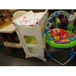 A collection of nursery items, to include a rocking chair with stool, a Little Wriggler changing