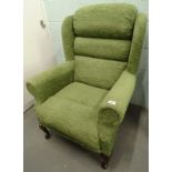 An armchair, in green fabric. The upholstery in this lot does not comply with the 1988 (Fire &
