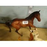 A Royal Doulton trotting horse, matt, right leg raised, head right, printed marks beneath, 22cm