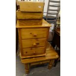 A pine low coffee table, chest of three drawers, and three cutlery trays.