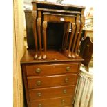 A nest of three mid 20thC walnut tables and an early 20thC mahogany chest of four long drawers on
