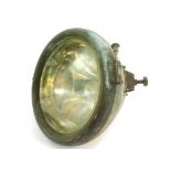 An early 20thC CAV car head lamp, metal cased, 24cm diameter.