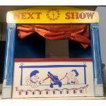 A wooden puppet show theatre, with fold in collapsible back.