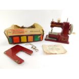 A Vulcan Senior child's sewing machine, part boxed.