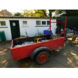 A red metal framed trailer, single axle, 246cm long, 122.5cm wide.