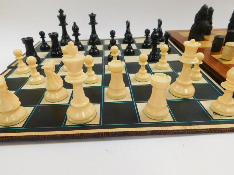 A replica resin Lewis chess set, with a wooden chess board, 47cm diameter, together with a plastic - Image 4 of 5