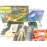 An Aurora AFX 24 hour race game, GX175O., Renwall The Invisible Man assembly kit, and an EX150